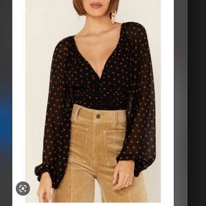 Beyond the Radar dotted cinched front cropped blouse